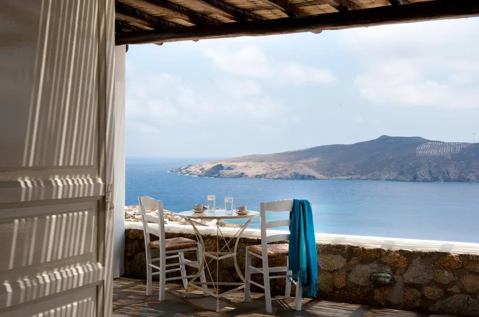 Terrace table and chairs looking out to the sea